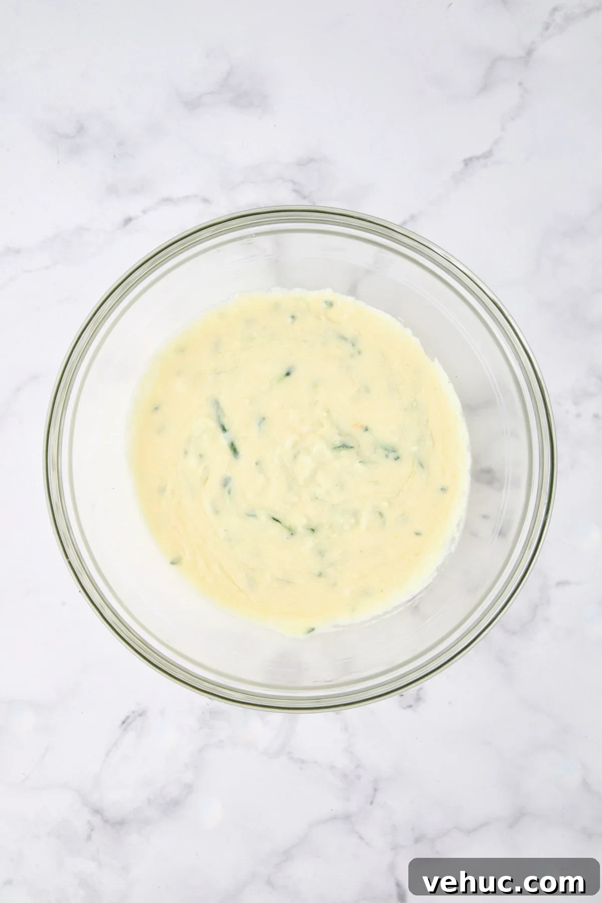 Zucchini Ricotta Dill Muffins: Savory Summer Snack 8 Wet ingredients for muffins in glass bowl.