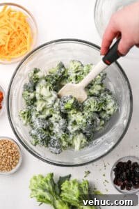 Crispy Broccoli Salad with Creamy Parmesan Dressing 18 A bowl of broccoli salad that's been dressed with a creamy dressing.