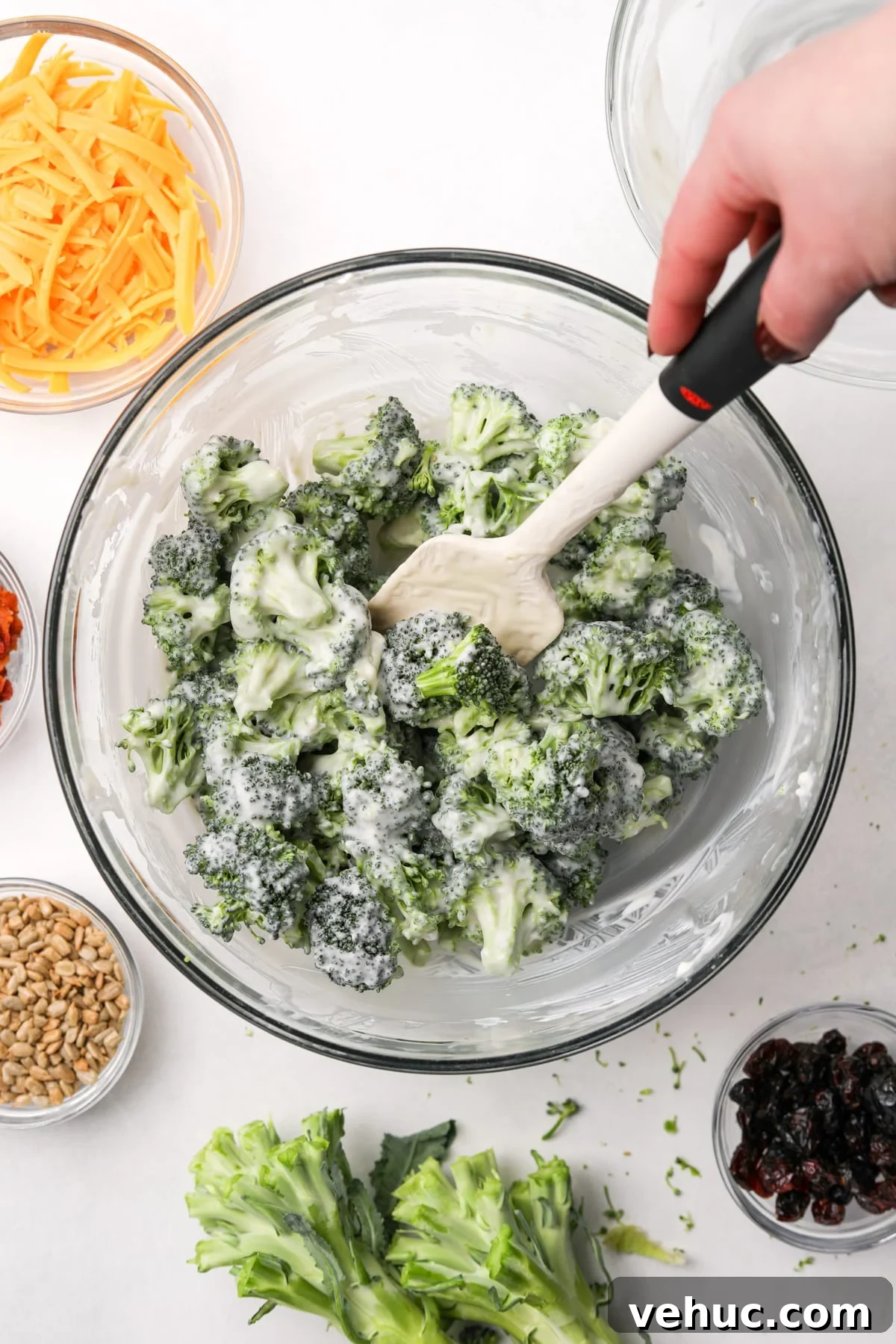 Crispy Broccoli Salad with Creamy Parmesan Dressing 8 A bowl of broccoli salad that's been dressed with a creamy dressing.