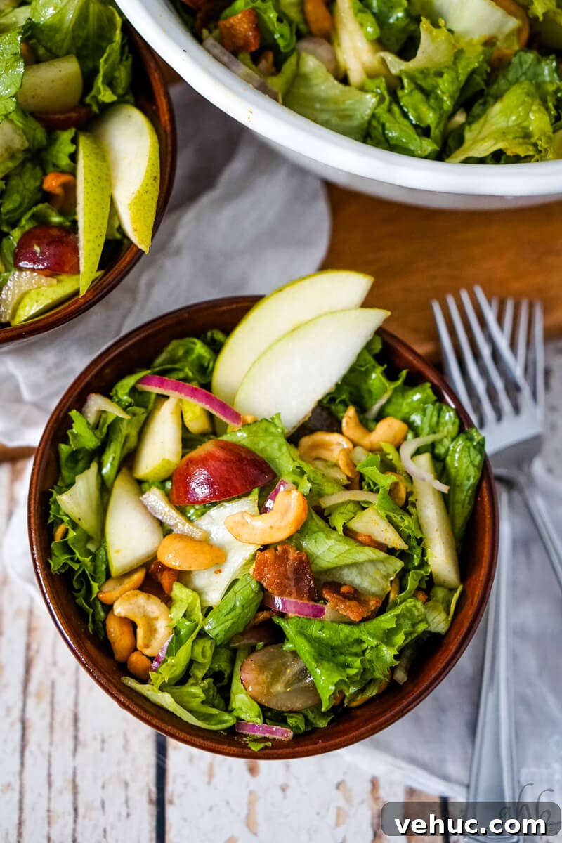 Crispy Cashew Salad with Lime Dressing: Refreshing Crunch Bowl 3 A serving of Cashew Nut Salad in a brown bowl.