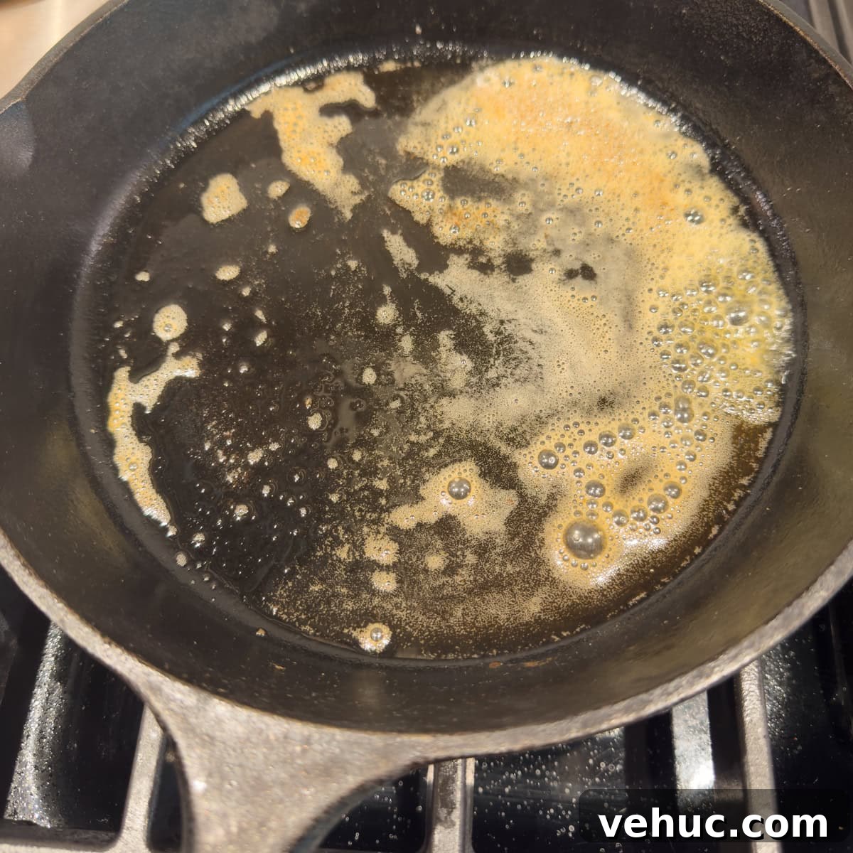 Gluten-Free Dutch Baby Pancake Recipe (German Pancake) 6 Melted butter in a hot black cast iron skillet.