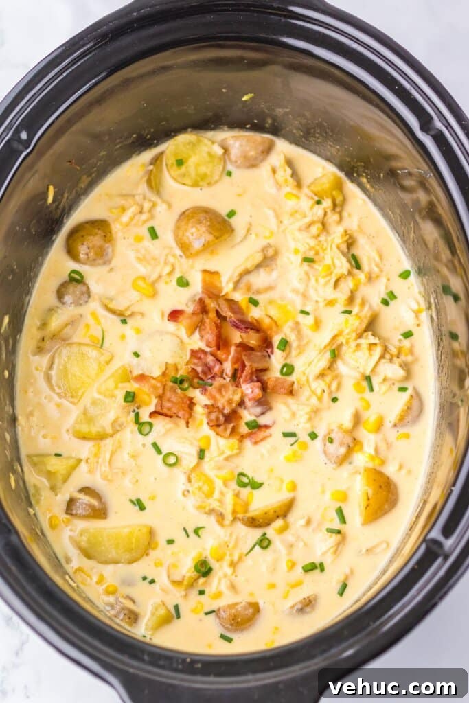Slow Cooker Creamy Chicken and Corn Chowder Recipe 8 Crockpot full of soup.