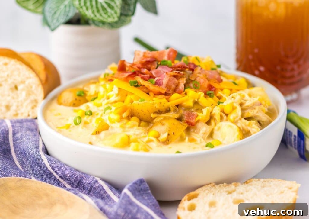 Slow Cooker Creamy Chicken and Corn Chowder Recipe 9 White bowl of chicken corn chowder.