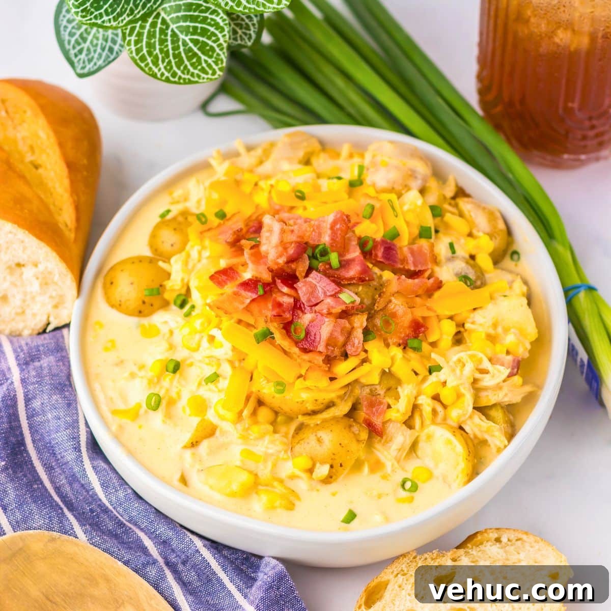 Slow Cooker Creamy Chicken and Corn Chowder Recipe 10 White bowl filled with chicken corn chowder.