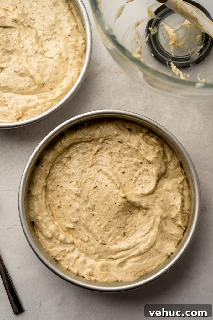 Decadent Butter Pecan Layer Cake Recipe 11 Butter pecan cake batter in a baking pan.