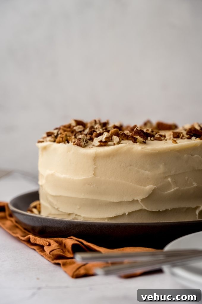 Decadent Butter Pecan Layer Cake Recipe 13 A butter pecan cake on a plate.