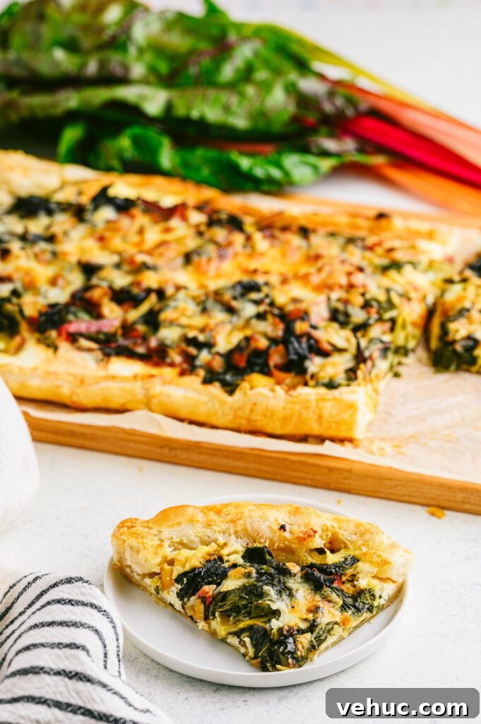 Vibrant Rainbow Swiss Chard Tart Recipe for Spring Entertaining 5 swiss chard tart slice on a white plate