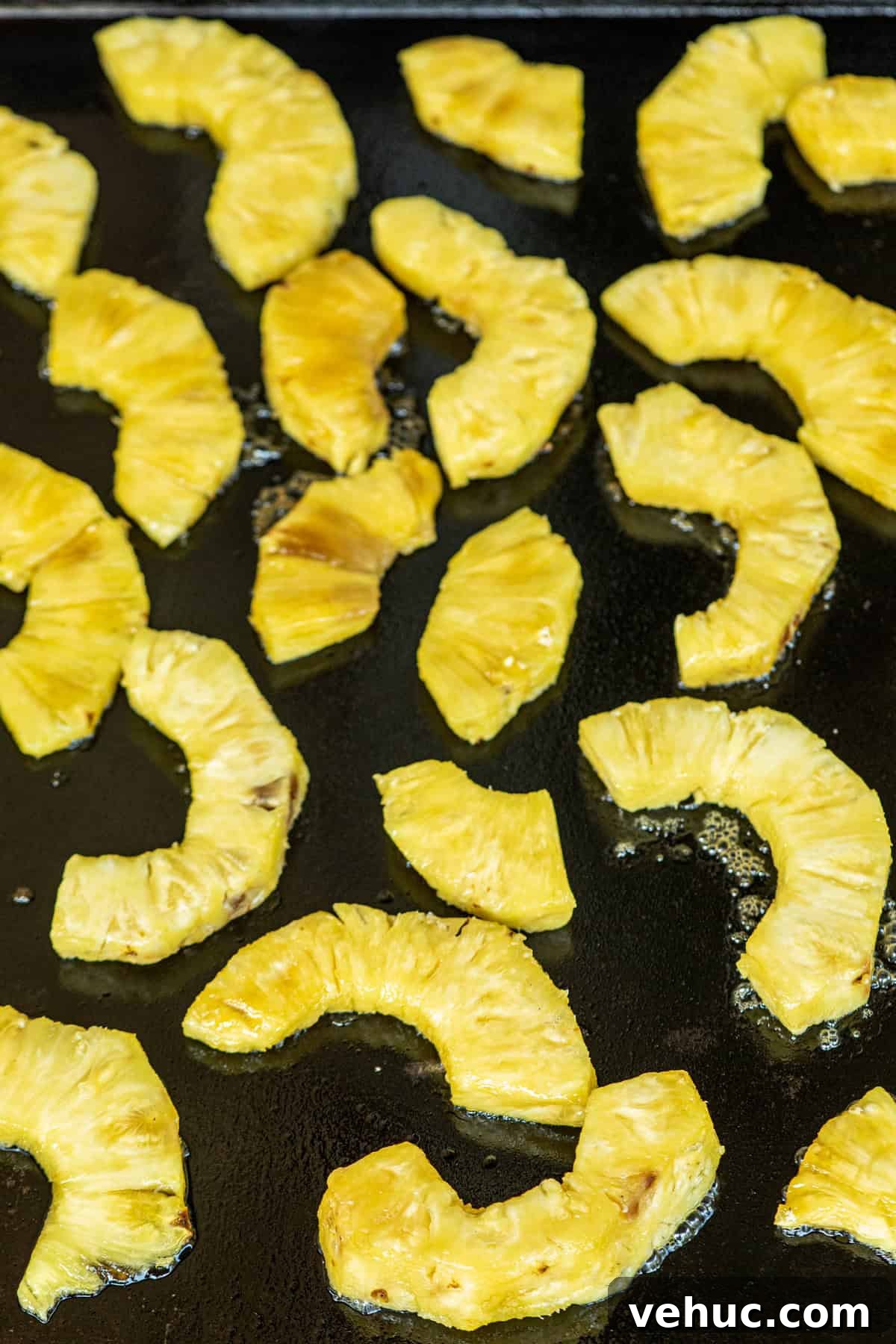 How to Grill Pineapple Perfectly: Sweet, Caramelized Slices Every Time 5 Grilled Pineapple pieces on grill