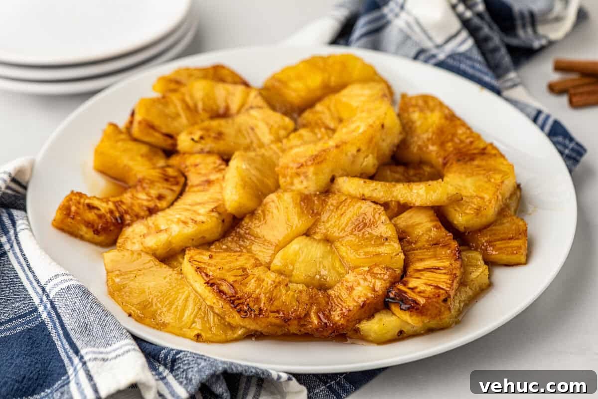 How to Grill Pineapple Perfectly: Sweet, Caramelized Slices Every Time 7 Grilled Pineapple pieces arranged on white plate
