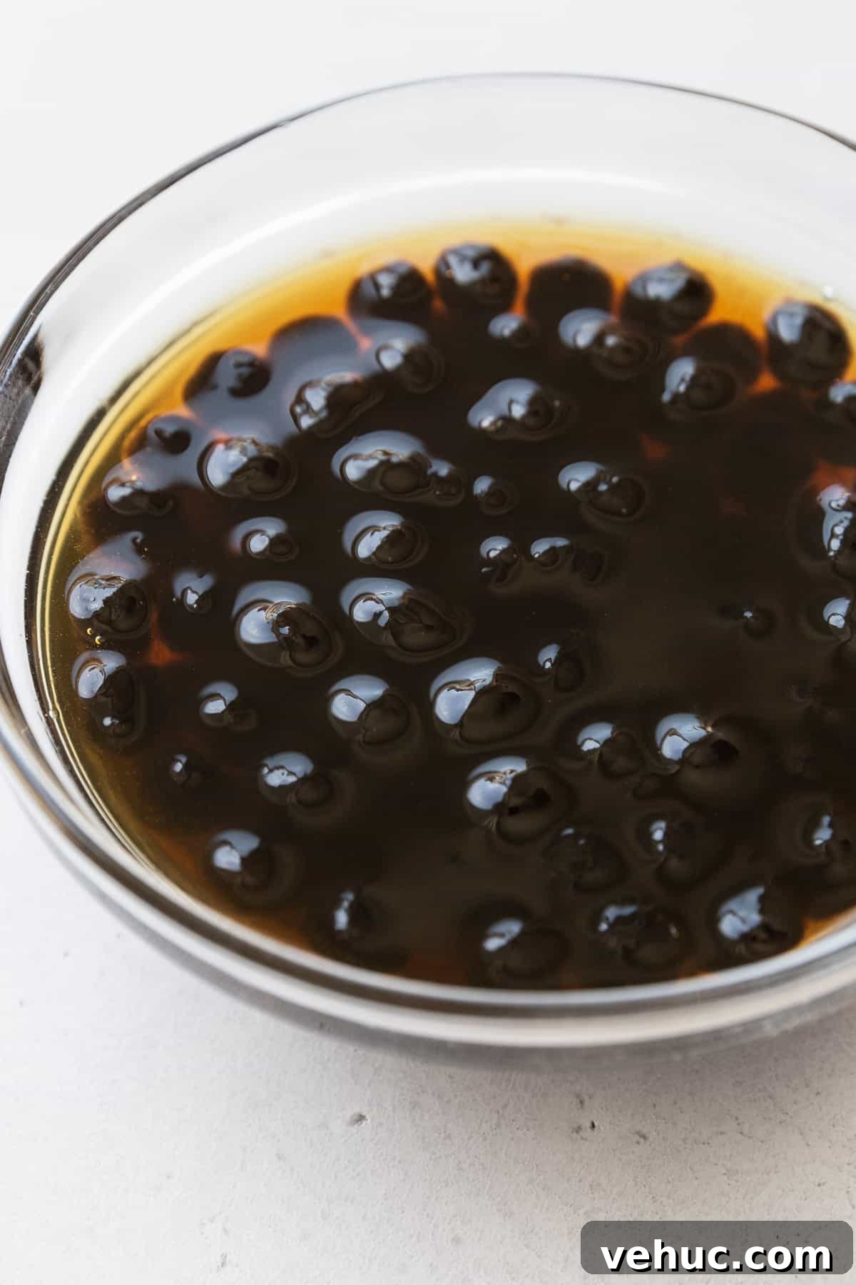 Mango Bubble Tea: Refreshing Homemade Boba Recipe 7 Soaking boba pearls in a small bowl of brown sugar simple syrup.