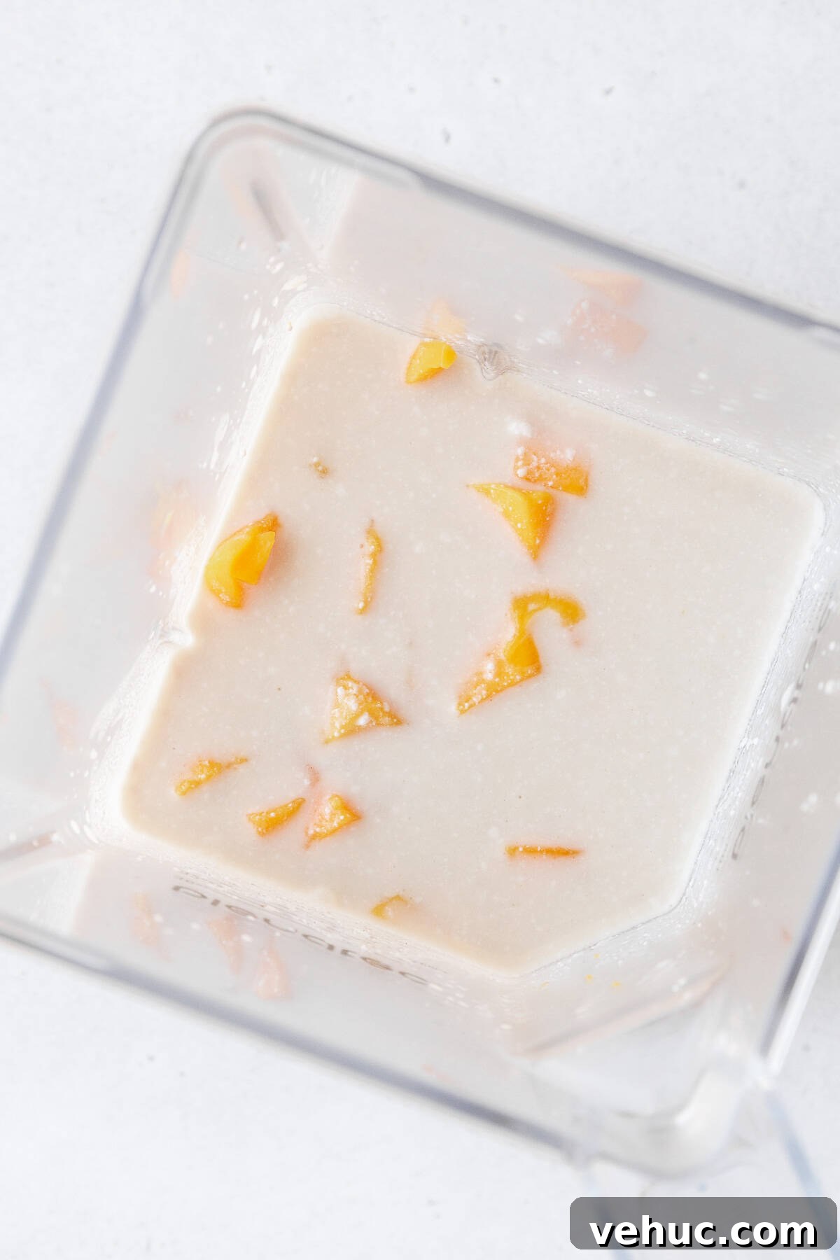 Mango Bubble Tea: Refreshing Homemade Boba Recipe 9 Cubed mango, tea, and coconut milk in a blender.