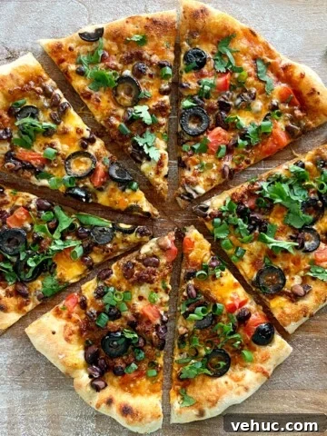 taco pizza cut into triangles.