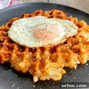 Crispy Tater Tots Made in a Waffle Iron: Quick Stove-Free Recipe 13 tater-tot-waffle-with-a-fried-egg-on-top.