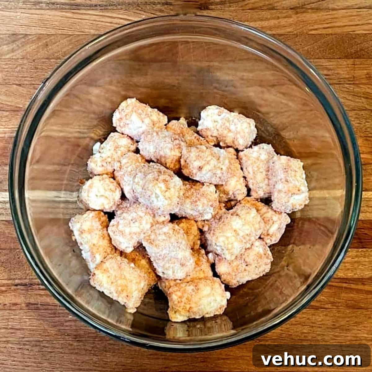 Crispy Tater Tots Made in a Waffle Iron: Quick Stove-Free Recipe 4 frozen tater tots in a bowl.