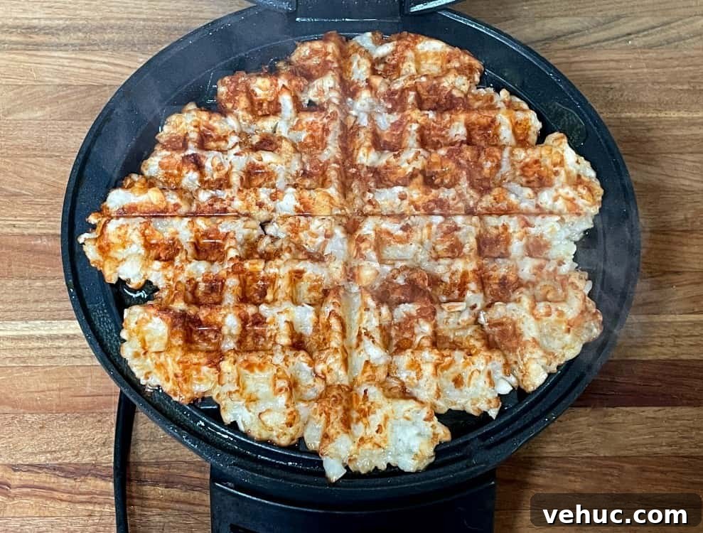 Crispy Tater Tots Made in a Waffle Iron: Quick Stove-Free Recipe 6 tater tots cooked in a waffle maker.