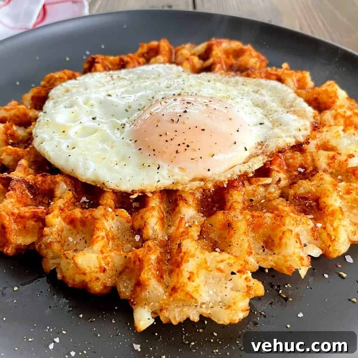 Crispy Tater Tots Made in a Waffle Iron: Quick Stove-Free Recipe 7 tater-tot-waffle-with-a-fried-egg-on-top.