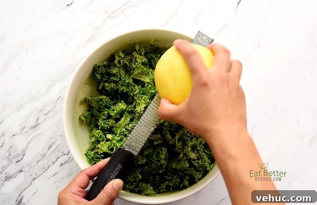 Creamy Avocado Massaged Kale Salad with Lemon Vinaigrette 5 Zesting Lemon over the salad