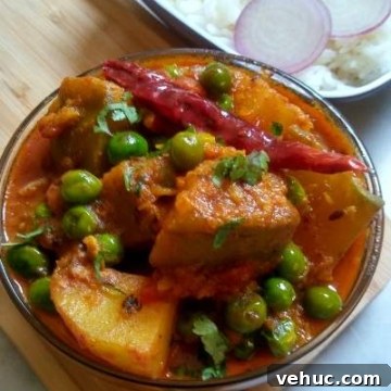 Kaddu Aloo Matar sabzi is a simple, comforting pumpkin, potato and green peas semi gravy recipe.