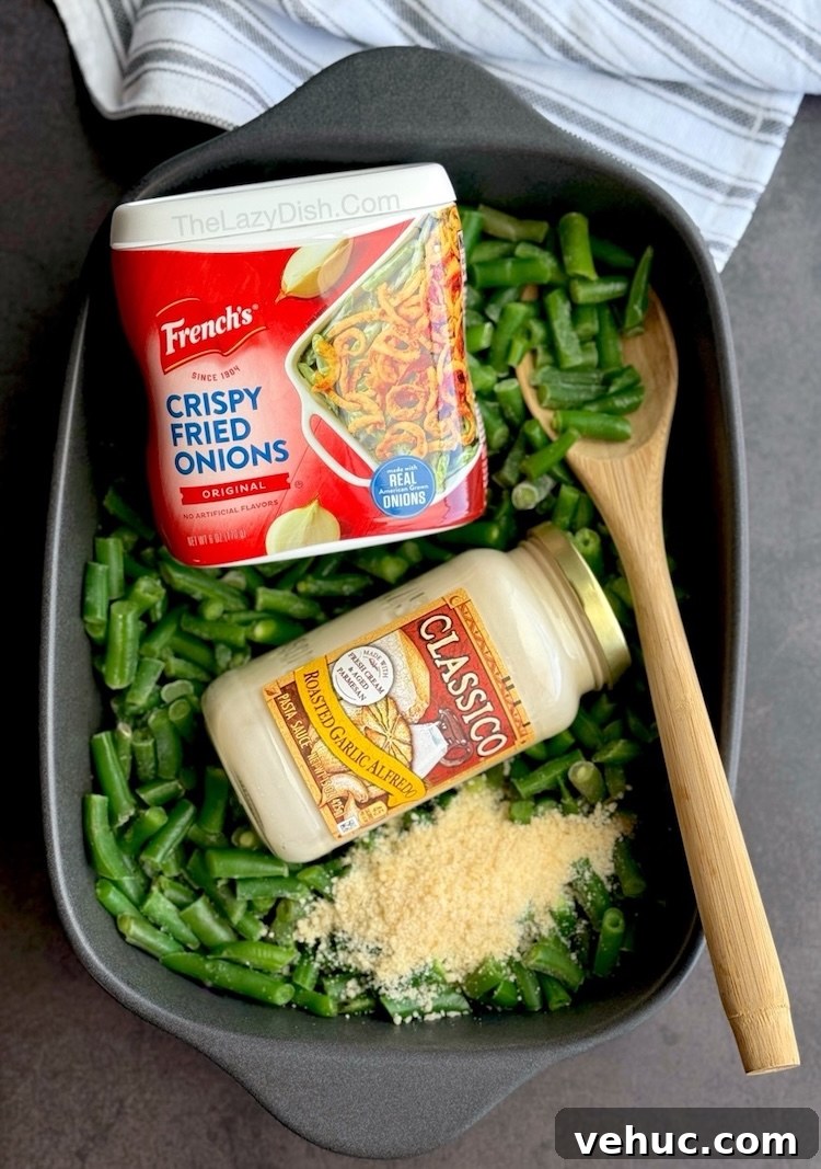 Creamy Green Bean Alfredo Casserole Recipe 7 Quick and easy green bean casserole made with Alfredo sauce, frozen green beans, and crispy French fried onions.