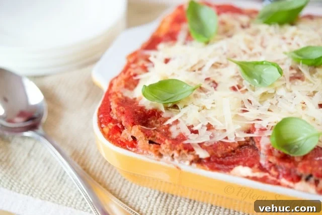 Lighter Eggplant Parmesan Recipe Eggplant Parmesan Lasagna - in Yellow Baking Dish with Basil On Top