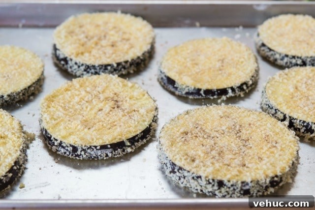 Baked Eggplant Parmesan Lasagna Recipe Slices of Breaded Eggplant on Sheet Pan