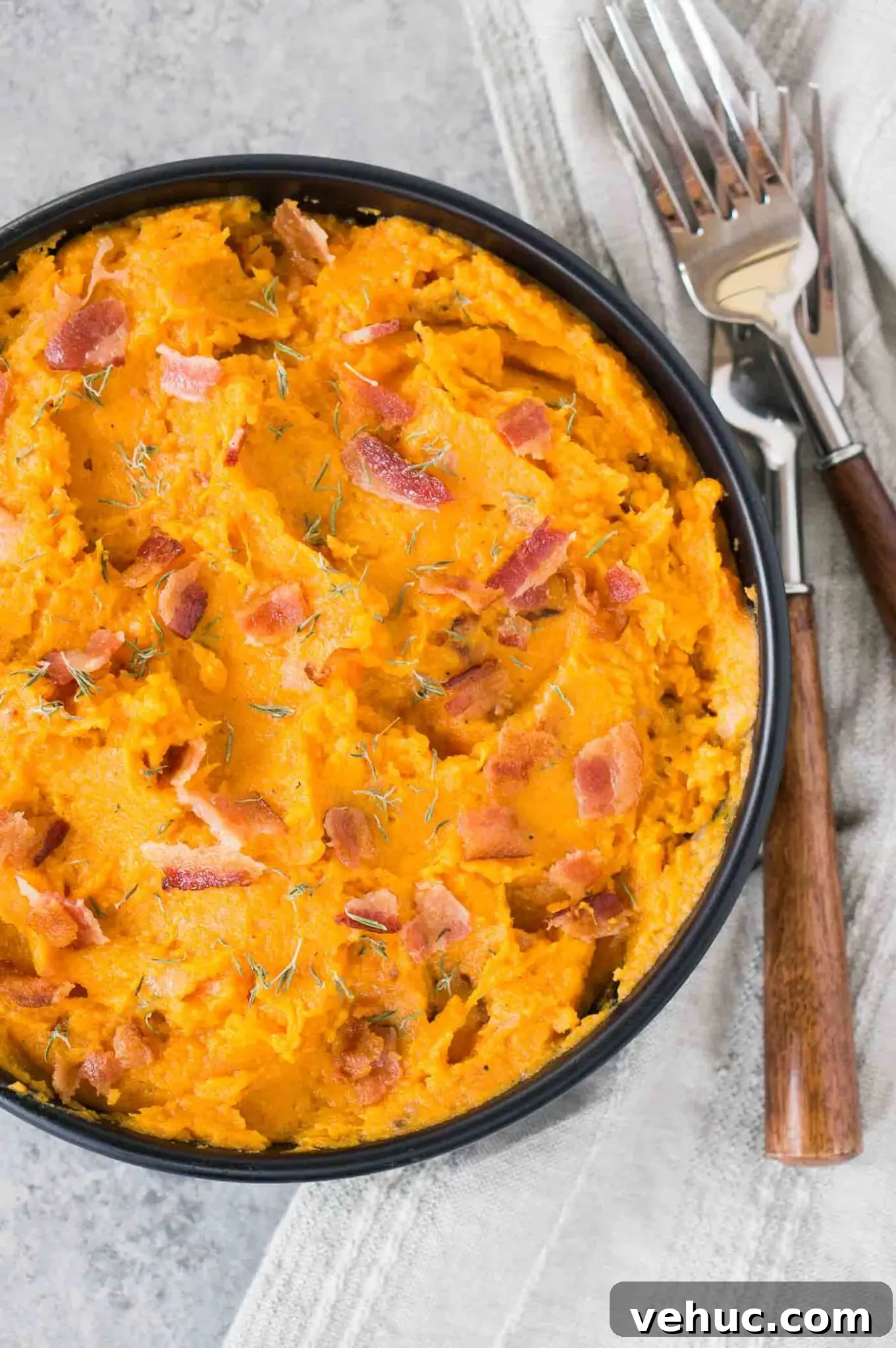 Creamy Mashed Sweet Potatoes with Crispy Bacon 2 mashed sweet potatoes with bacon in a bowl