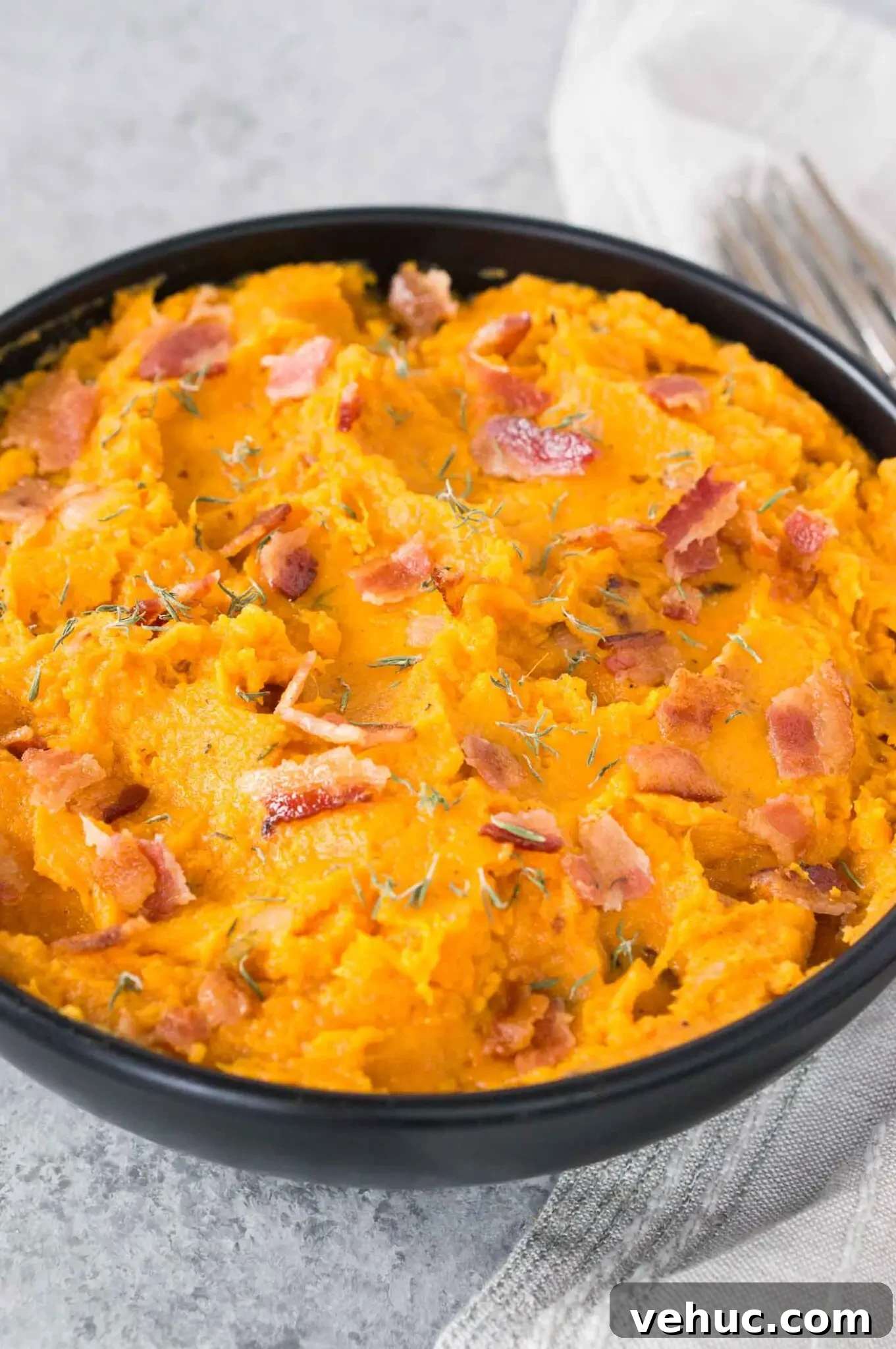 Creamy Mashed Sweet Potatoes with Crispy Bacon 7 bacon with mashed and roasted sweet potatoes in a bowl