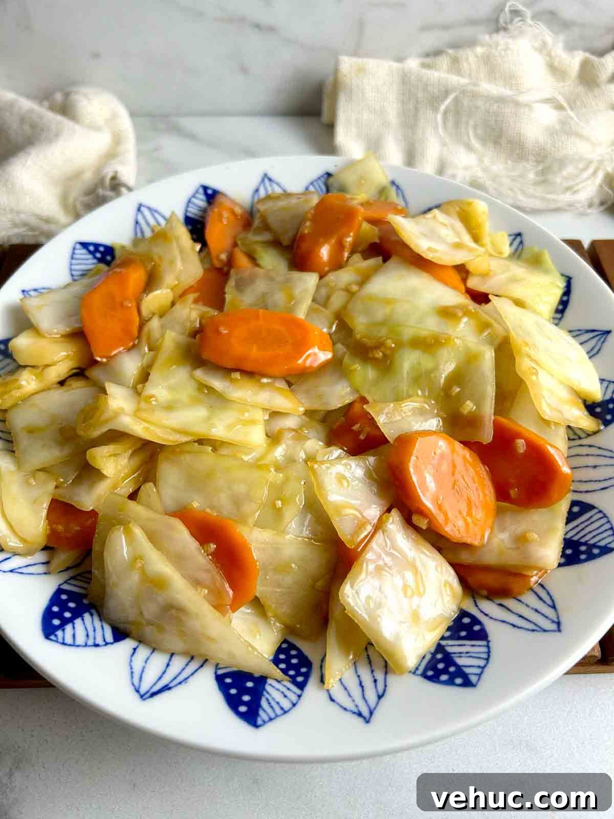 side view of carrots and cabbage stir-fry on plate