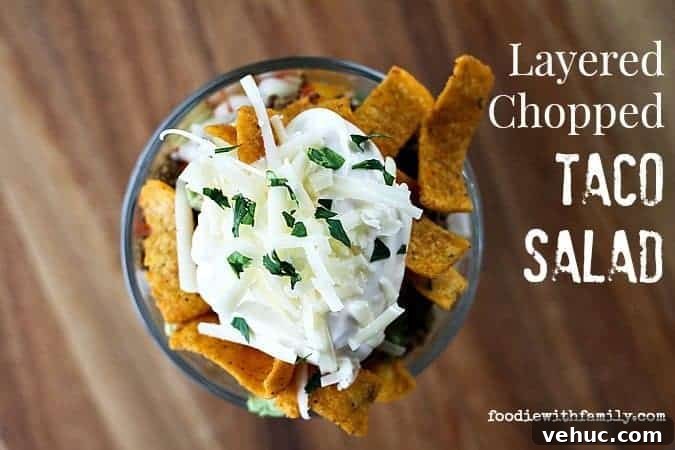 Layered Taco Salad with Seasoned Beef, Cheese, and Avocado 4 Layered Chopped Taco Salad from foodiewithfamily.com