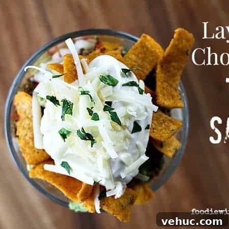 Layered Taco Salad with Seasoned Beef, Cheese, and Avocado 5 Layered Chopped Taco Salad from foodiewithfamily.com