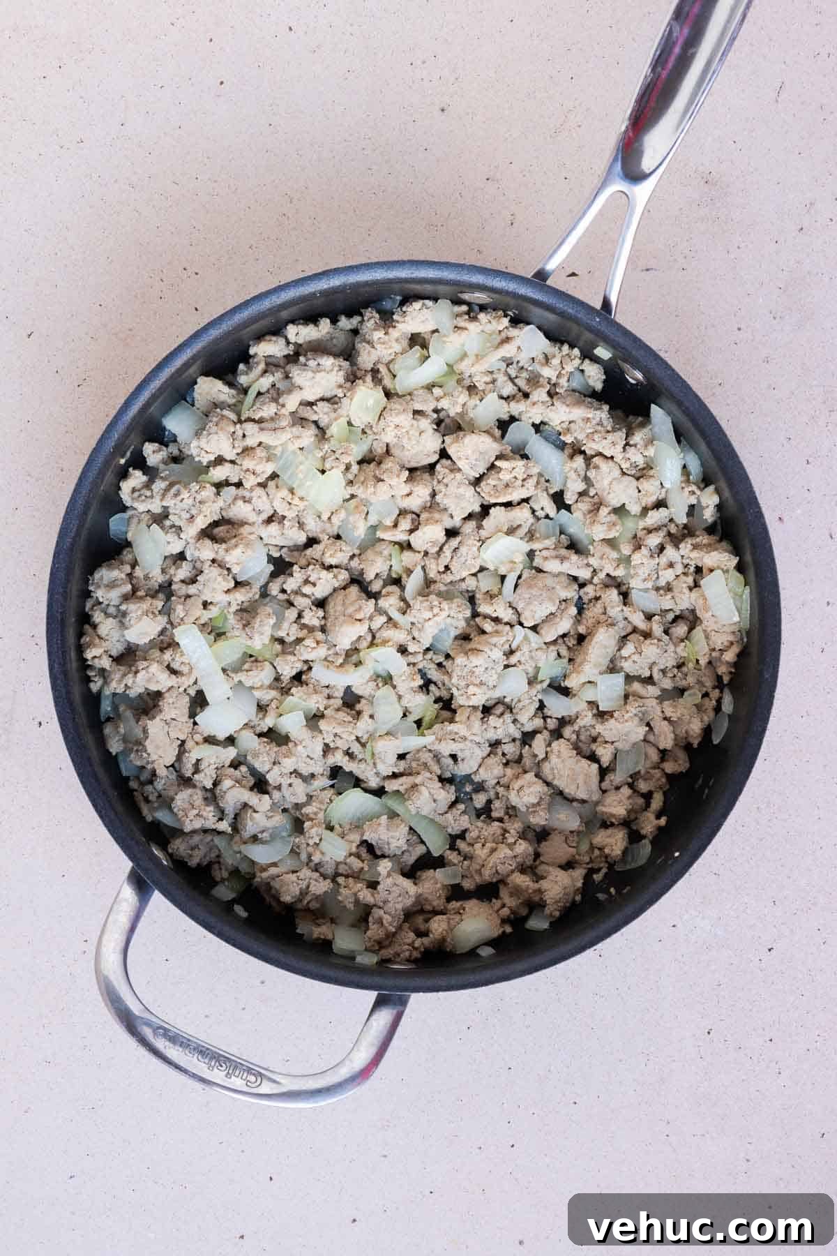 Cheesy Ground Turkey Tater Tot Casserole Recipe 4 The ground turkey is cooked and the onions are translucent.