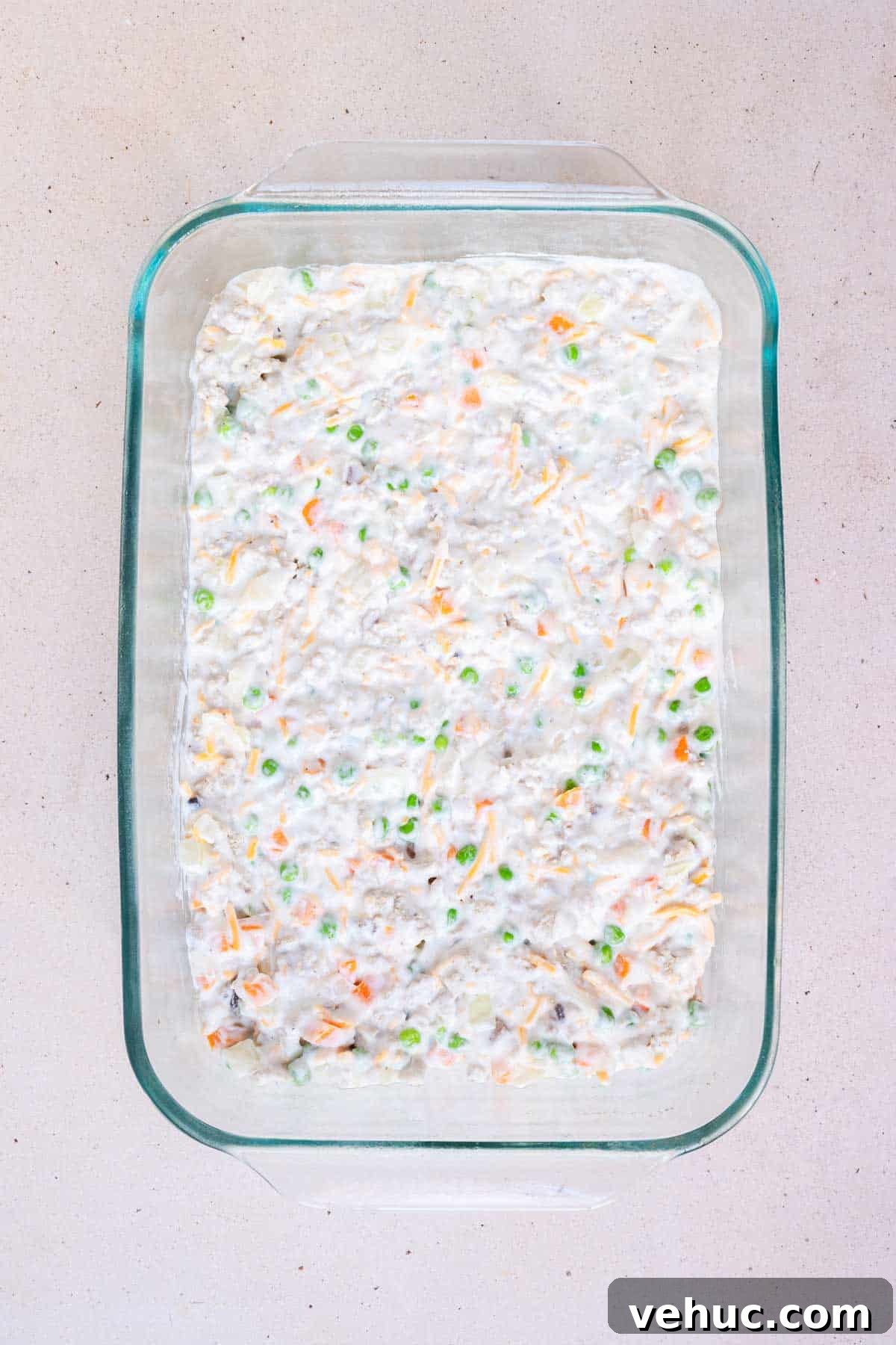 Cheesy Ground Turkey Tater Tot Casserole Recipe 6 The turkey mixture is spread evenly into the bottom of a 9 by 13 inch casserole dish.