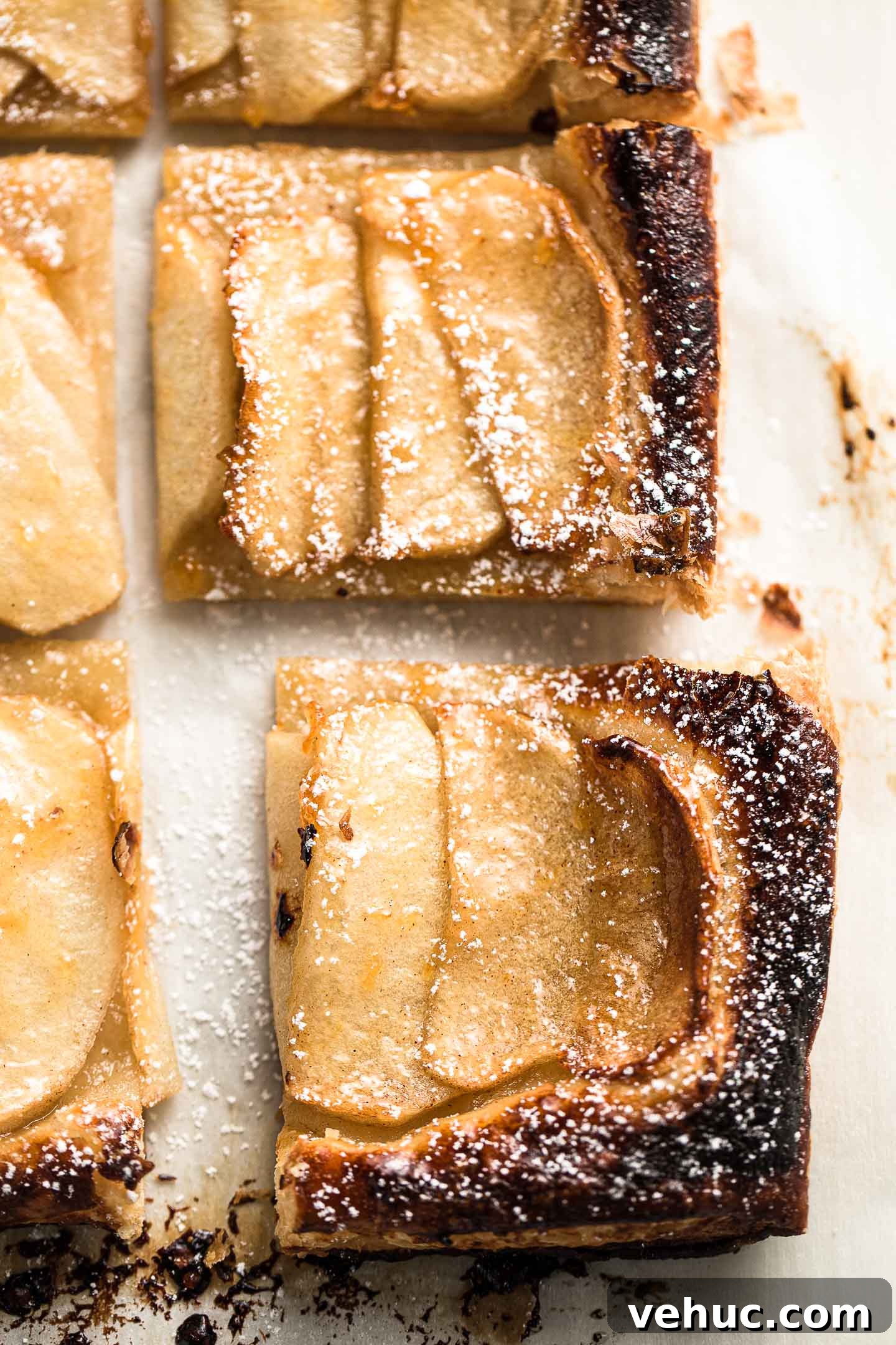 Rustic Apple Tart Recipe with Flaky Puff Pastry and Cinnamon 2 Close up photo of an apple tart square.