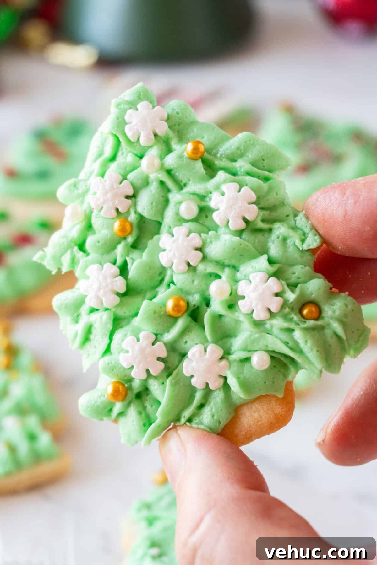 Christmas Tree Cookie Recipes: Festive Holiday Treat Ideas 16 close up of Christmas Tree Cookie with snowflake sprinkles