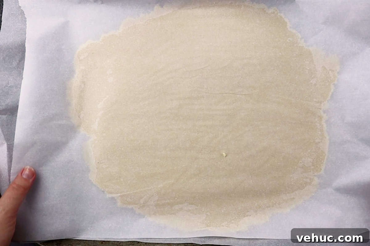 Christmas Tree Cookie Recipes: Festive Holiday Treat Ideas 8 dough rolled flat between parchment paper