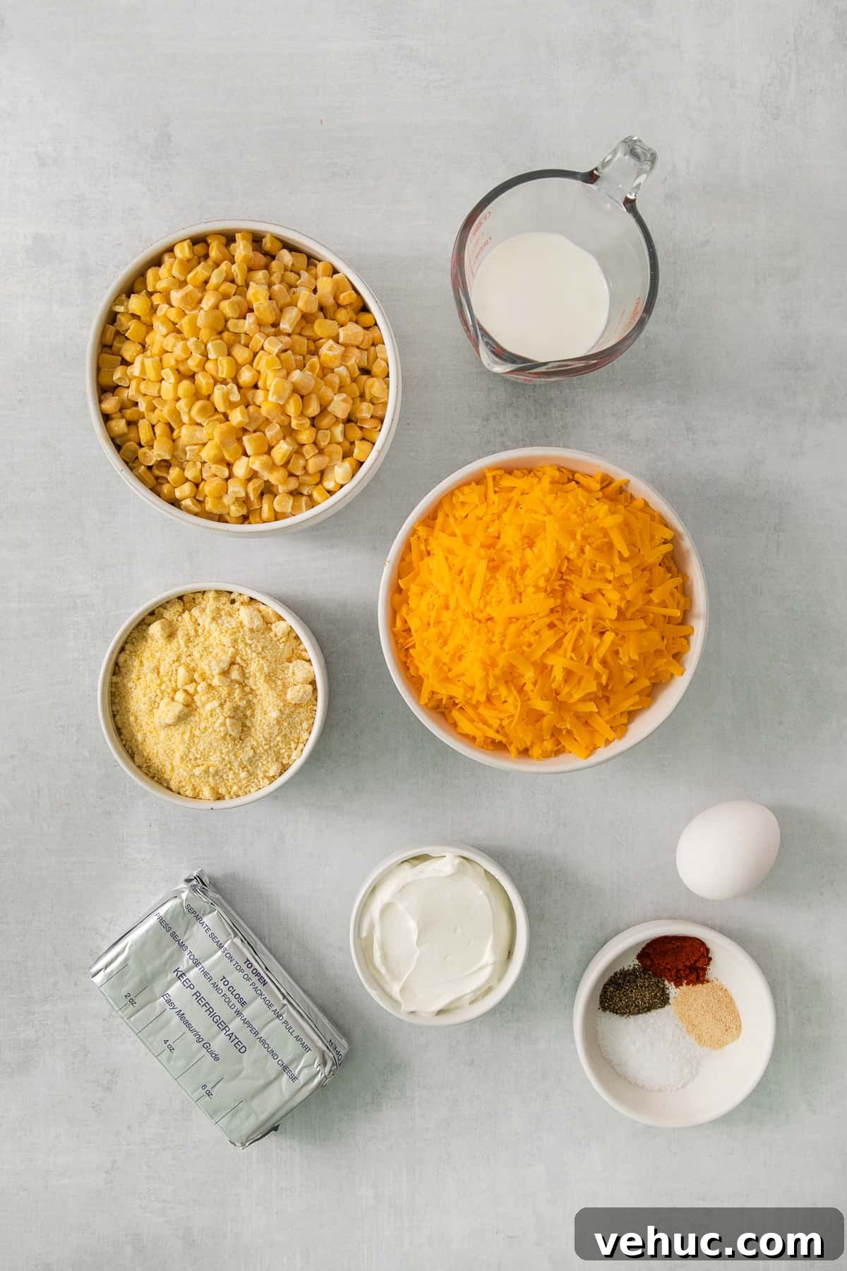 Creamy Cheddar Corn Casserole Recipe for Comforting Sides 4 a table topped with bowls filled with different types of food.