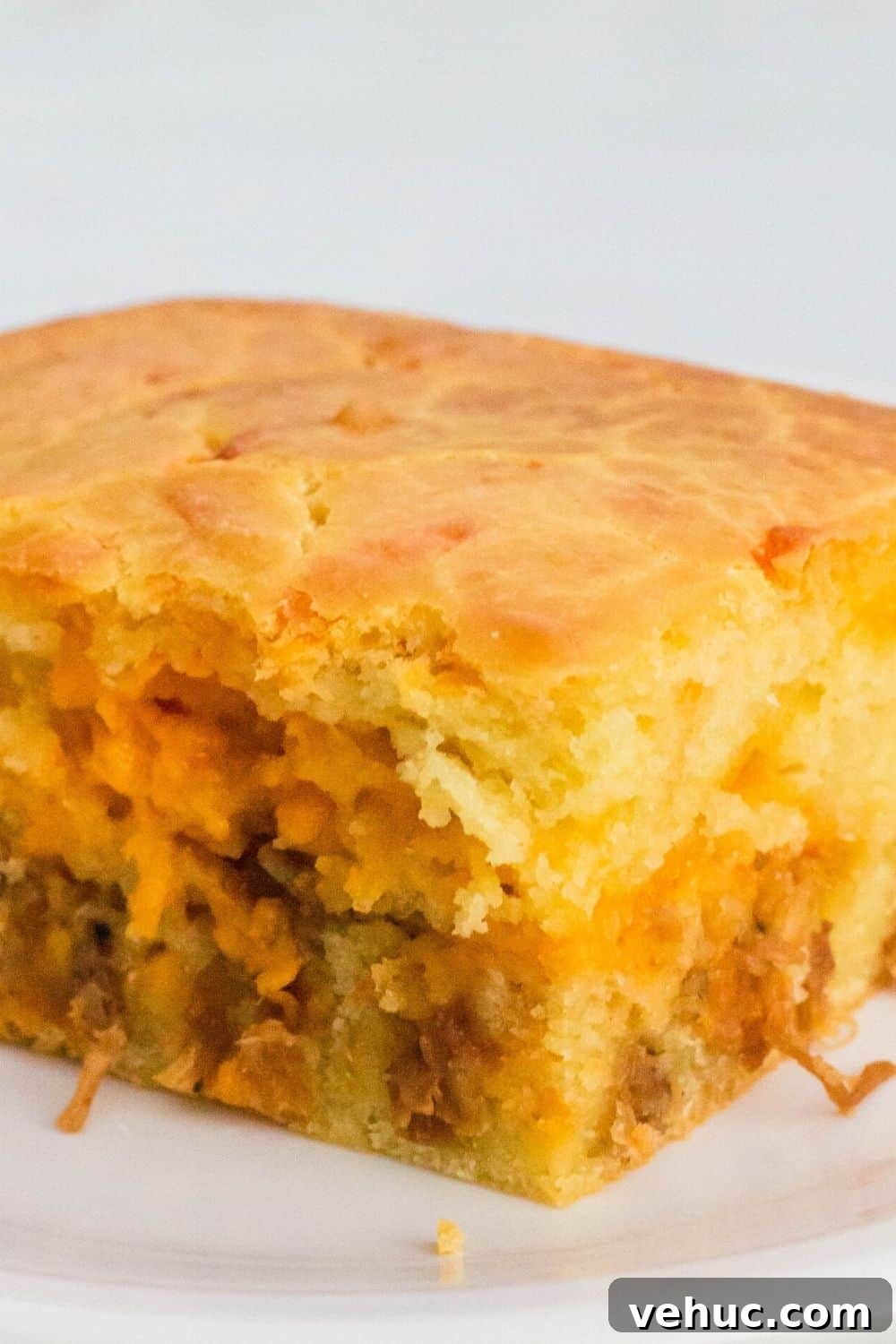 Bola de Carne Portuguese Meatloaf Recipe — Authentic & Flavorful 4 close-up view of a slice of bola de carne, a portuguese bread stuffed with meat and cheese