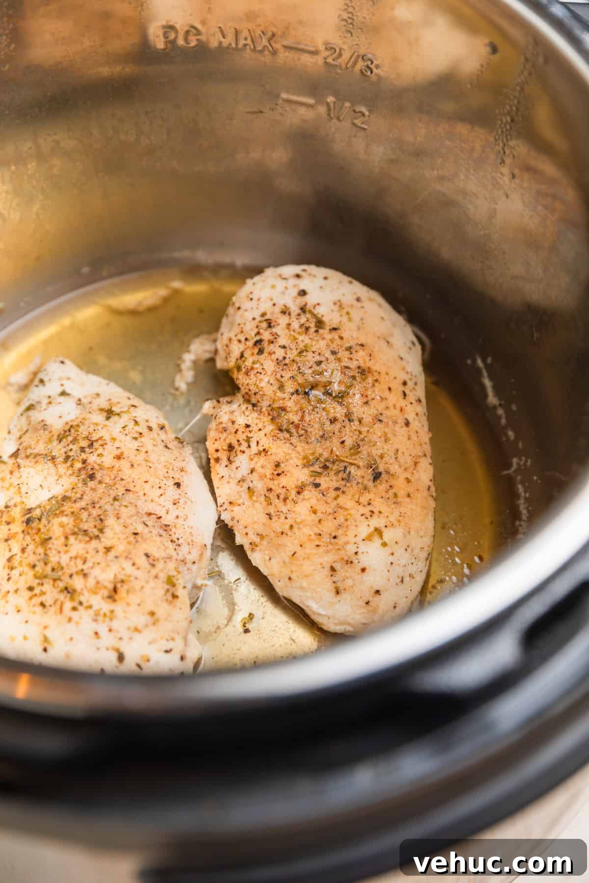 Creamy Parmesan Chicken in the Instant Pot: Quick Weeknight Meal 5 Cooked chicken breast in Instant pot.