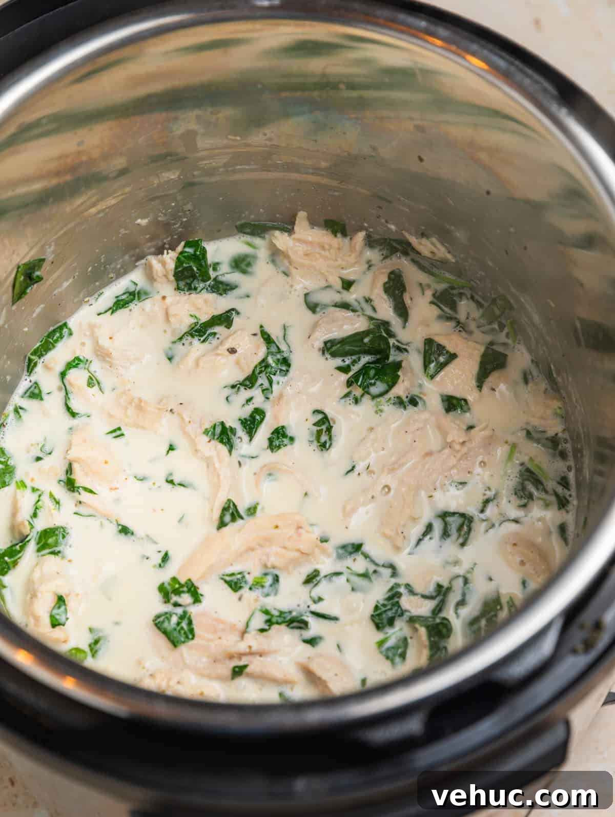 Creamy Parmesan Chicken in the Instant Pot: Quick Weeknight Meal 6 Creamy chicken in Instant pot with parmesan and spinach.