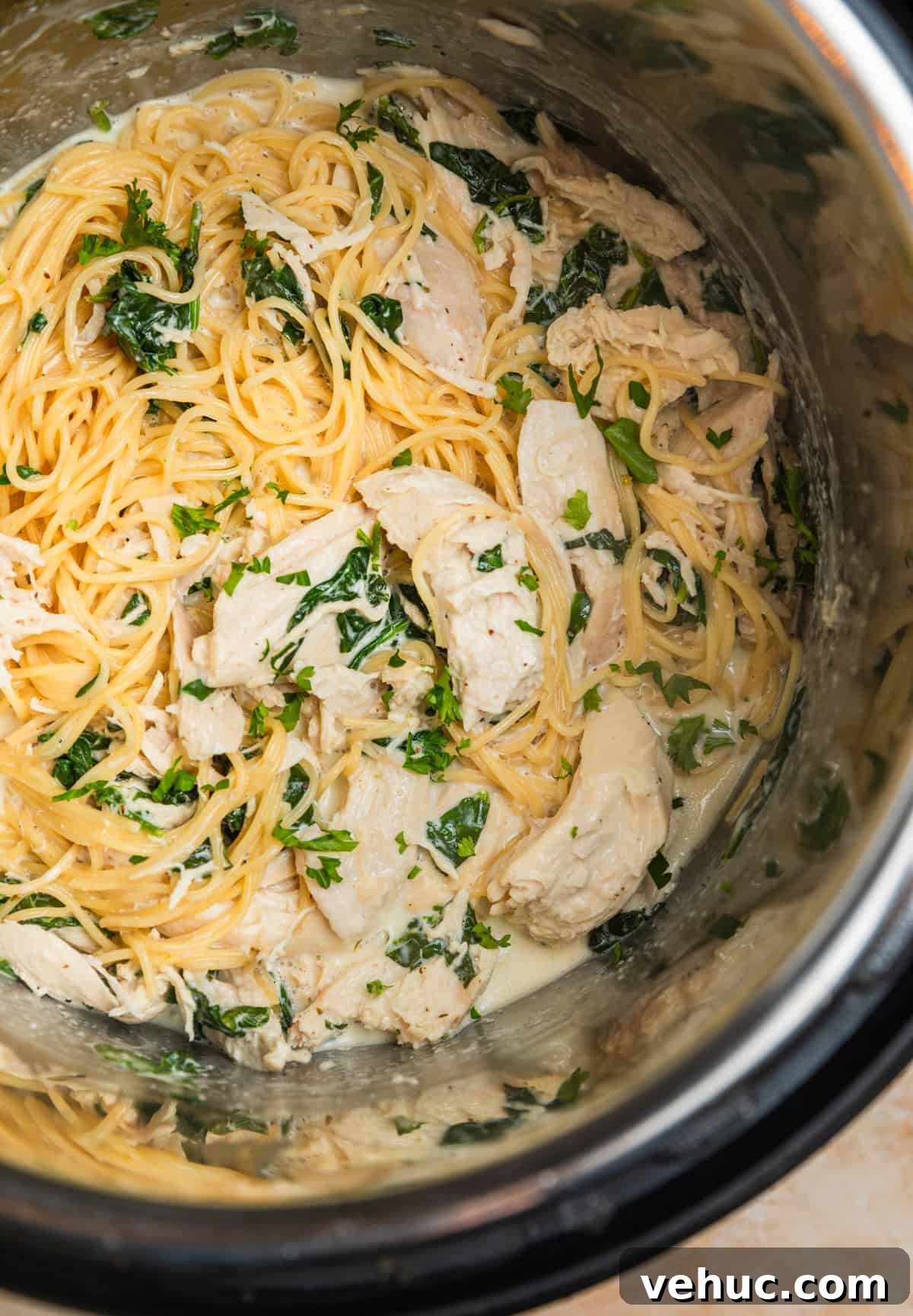 Creamy Parmesan Chicken in the Instant Pot: Quick Weeknight Meal 7 Instant pot with pasta tossed with creamy parmesan chicken.