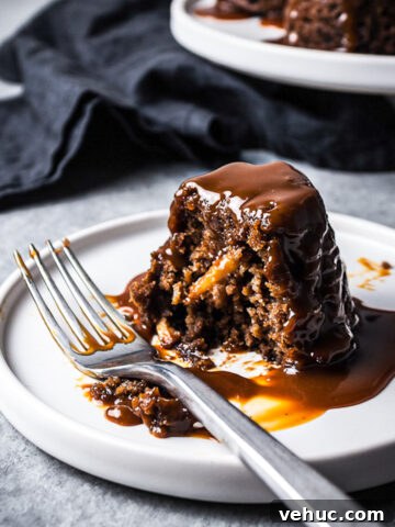 Close up of a mini cake on a white plate