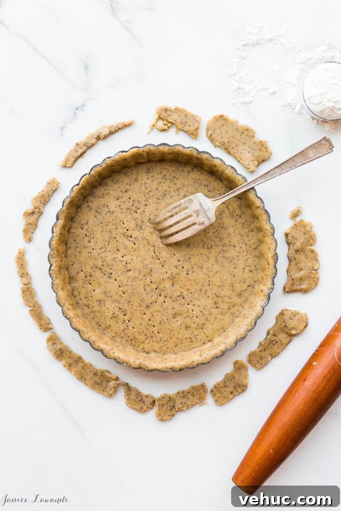 Essential Baking Tools: Complete Guide to Must-Have Equipment 4 Coffee sablé cookie crust - the raw crust is being docked (pricked) with a fork to allow steam/air to vent during baking. The crust will be blind baked