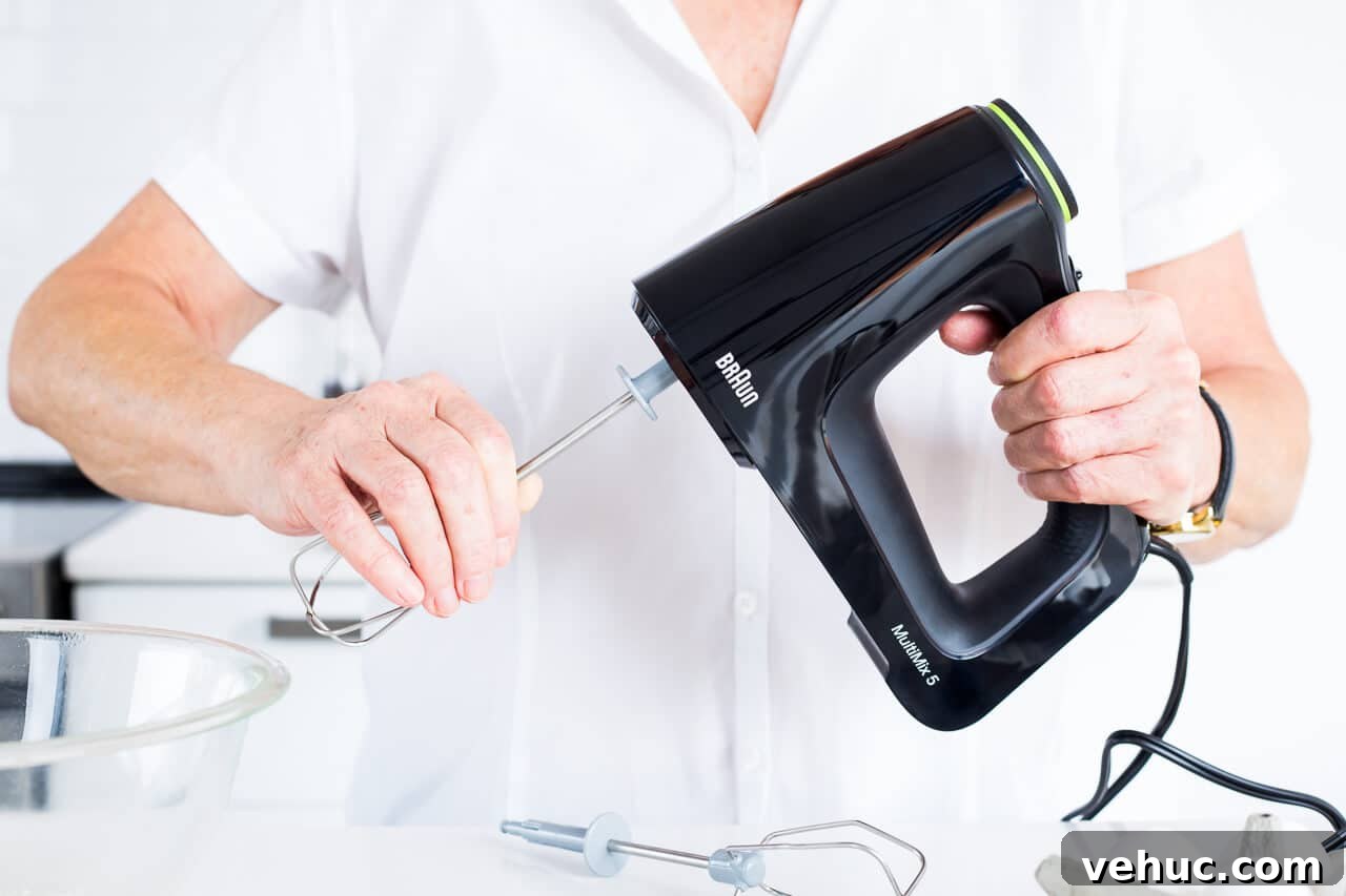 Essential Baking Tools: Complete Guide to Must-Have Equipment 5 Attaching beaters to Braun hand mixer is easy.