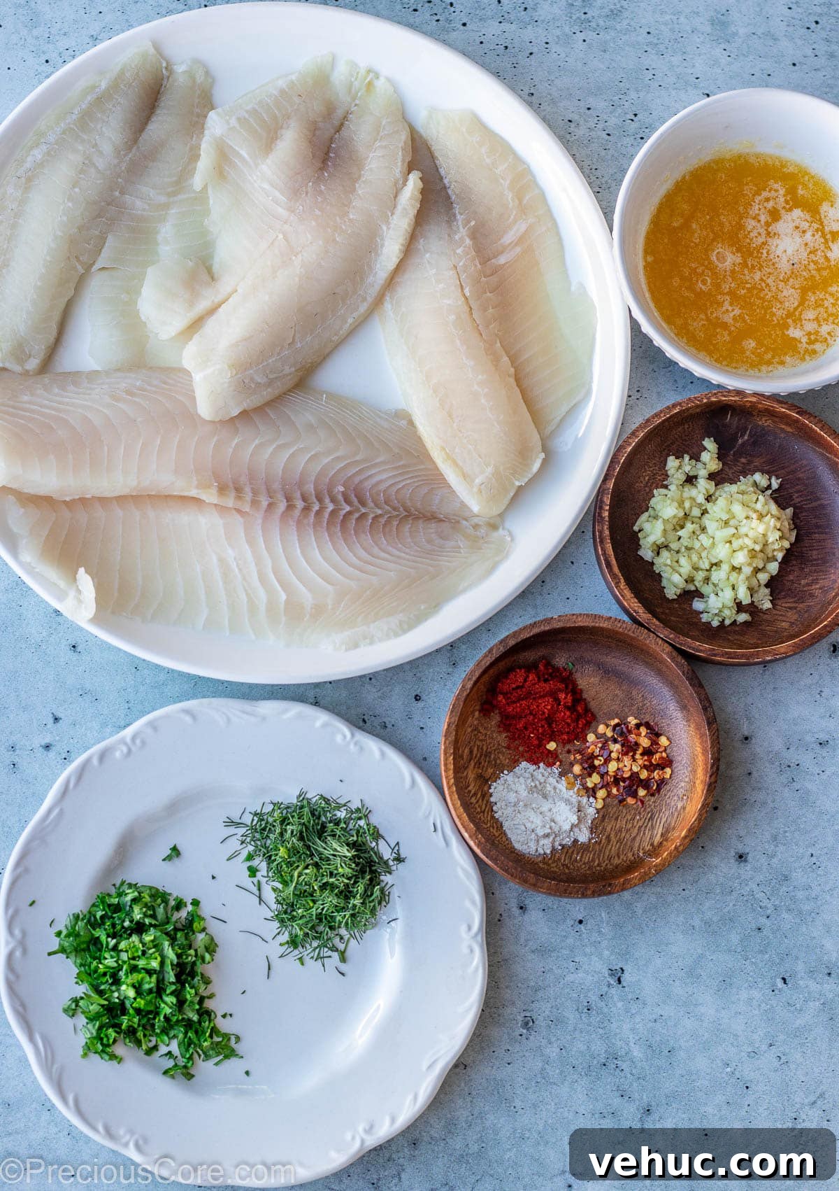Garlic Butter Tilapia Recipe with Lemon and Herbs 3 Ingredients for Garlic Butter Tilapia on a slab