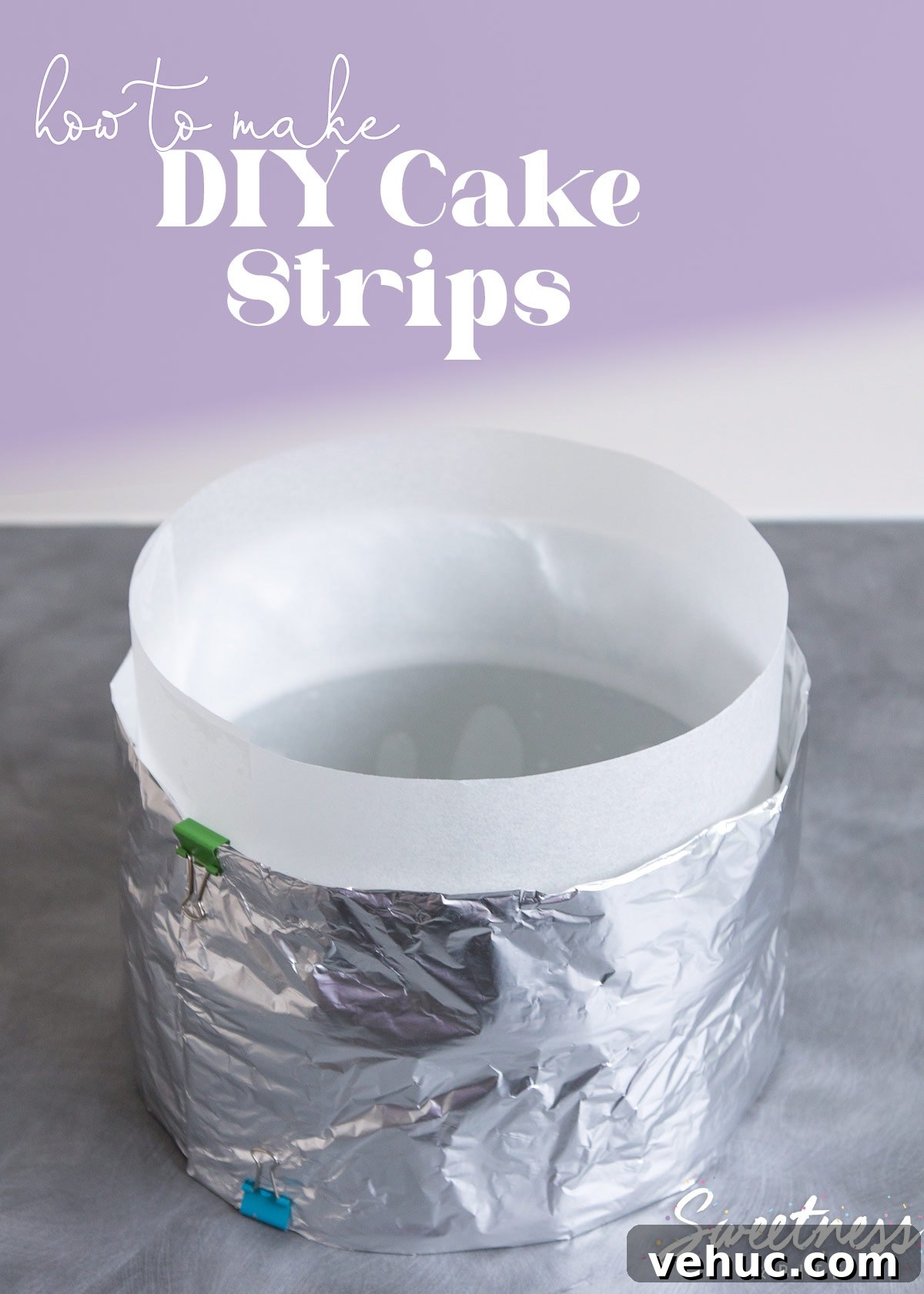 DIY Cake Strips: How to Wrap, Use, and Bake Even Layers 2 A round cake pan lined with baking paper and wrapped with a foil diy cake strip.