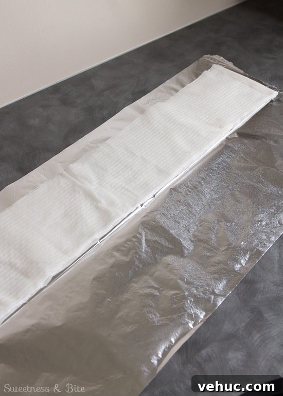 DIY Cake Strips: How to Wrap, Use, and Bake Even Layers 8 The wet strip of paper towels, placed on one half of the folded strip of foil.