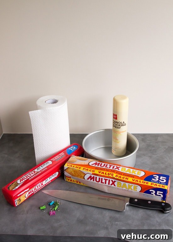 DIY Cake Strips: How to Wrap, Use, and Bake Even Layers 3 The supplies needed to make cake strips - foil, baking paper, cooking oil spray, paper towels, binder clips and a knife.
