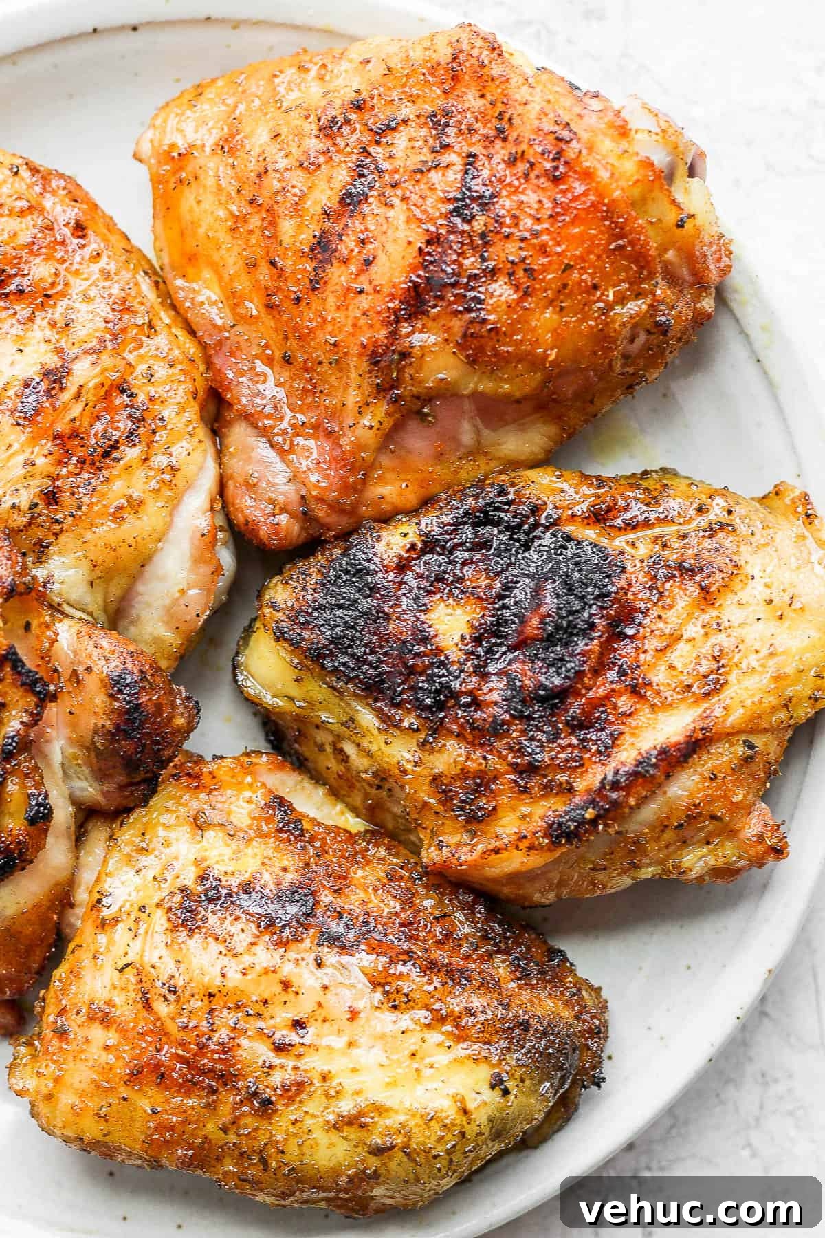 Plate of smoked chicken thighs. 