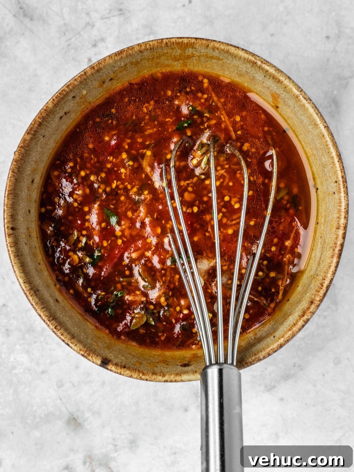 Honey Harissa Salmon with Garlic, Thyme & Lemon Roast 5 A bowl of harissa honey marinade with thyme, mustard and garlic.