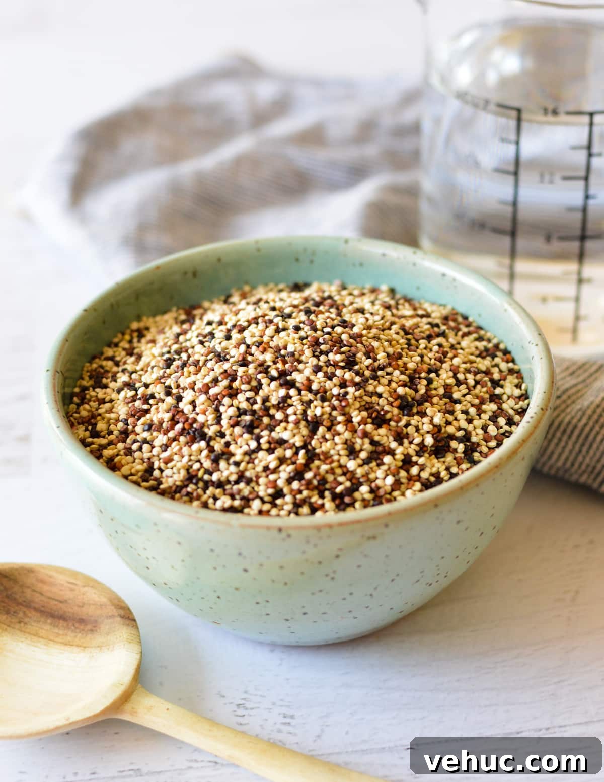 How to Cook Tri-Color Quinoa Perfectly Every Time 3 a bowl of multi colored quinoa seeds.